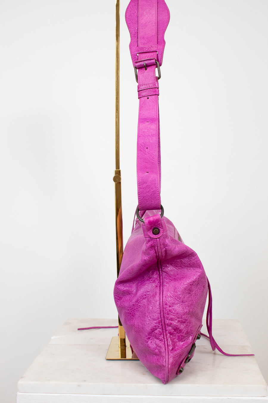 Purple bag with a strap on a white background