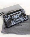 Balenciaga wallet with graffiti design on a gray background