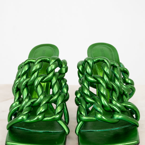 Pair of green metallic sandals with chain-like design on a white background