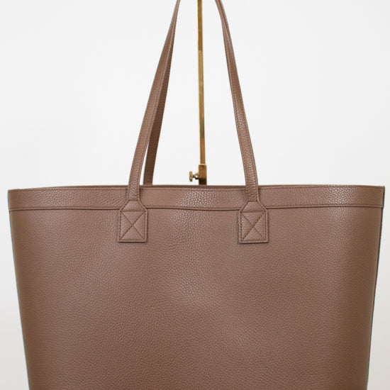 Brown tote bag on a white background