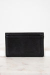 Black leather wallet on a white marble surface