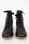 Lace up boots on white background