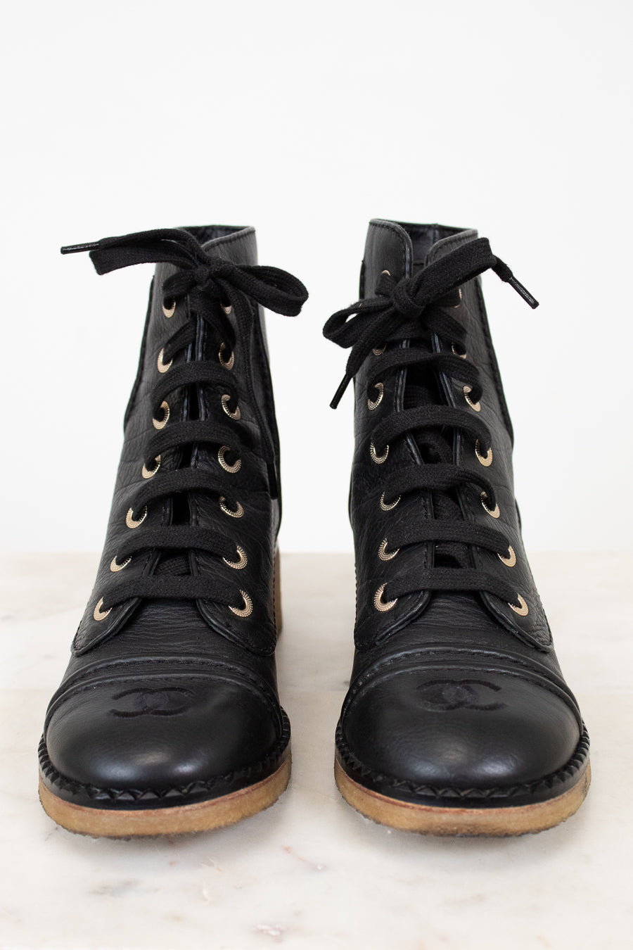Lace up boots on white background