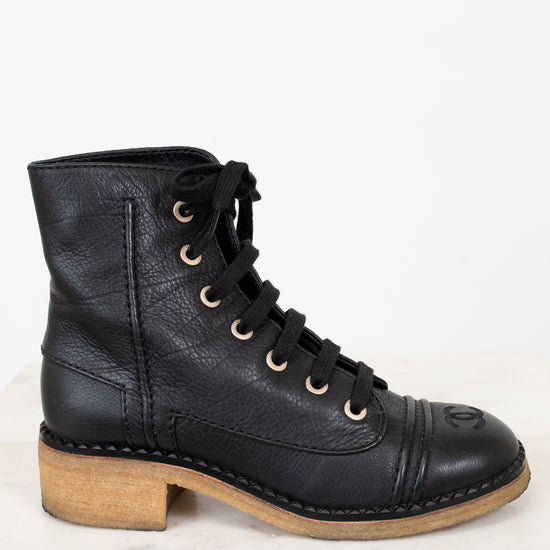 Side view of combat boot on white background