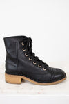 Side view of combat boot on white background