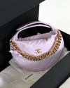 Chanel handbag with gold chain on a white background