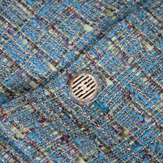Close-up of a textured blue fabric with a circular pattern