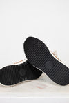 Black rubber sole of a shoe on a white background