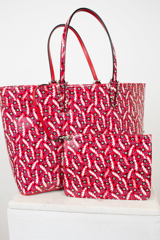 Red and white patterned tote bag with matching pouch on a white background
