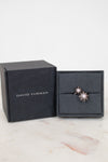 David Yurman earrings in a black box on a marble surface