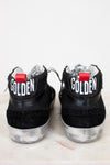 Black high-top sneakers with 'GOLDEN' branding on a white background