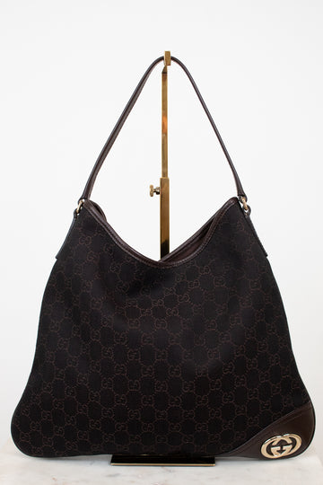 Brown Gucci logo printed purse on white background