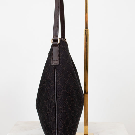 Brown Gucci logo printed purse on white background