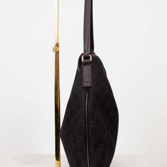 Brown Gucci logo printed purse on white background