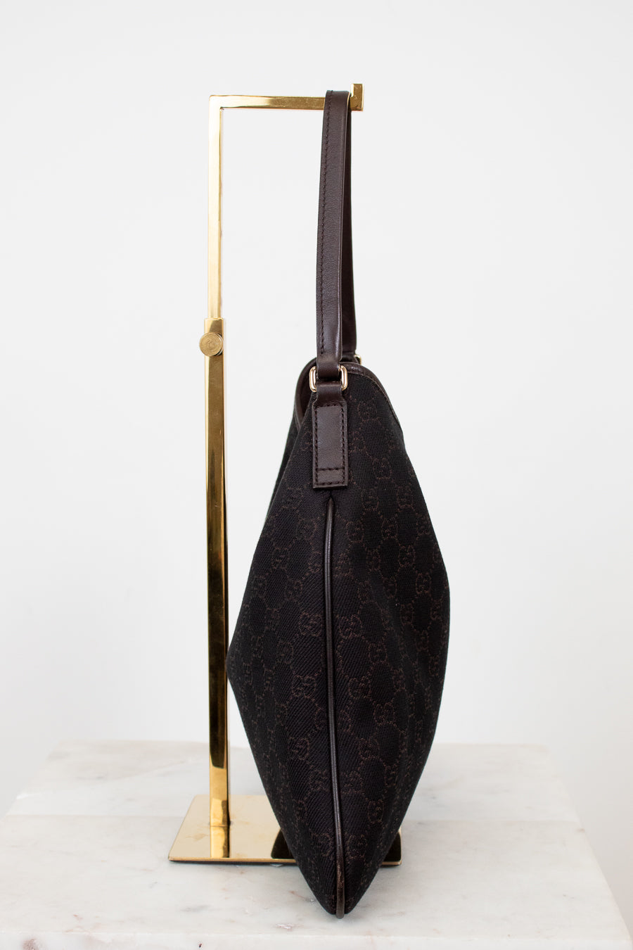 Brown Gucci logo printed purse on white background