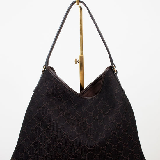 Brown Gucci logo printed purse on white background