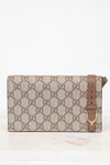 Designer handbag with a prominent brand logo on a white background