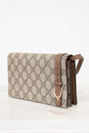 Beige handbag with brown strap on a white background