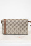 Designer handbag with brown and beige pattern on a white background