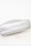 Silver bottom of bag on a marble surface