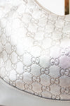 Close-up of a Gucci handbag with monogram pattern