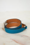 Blue leather bracelet on a marble surface