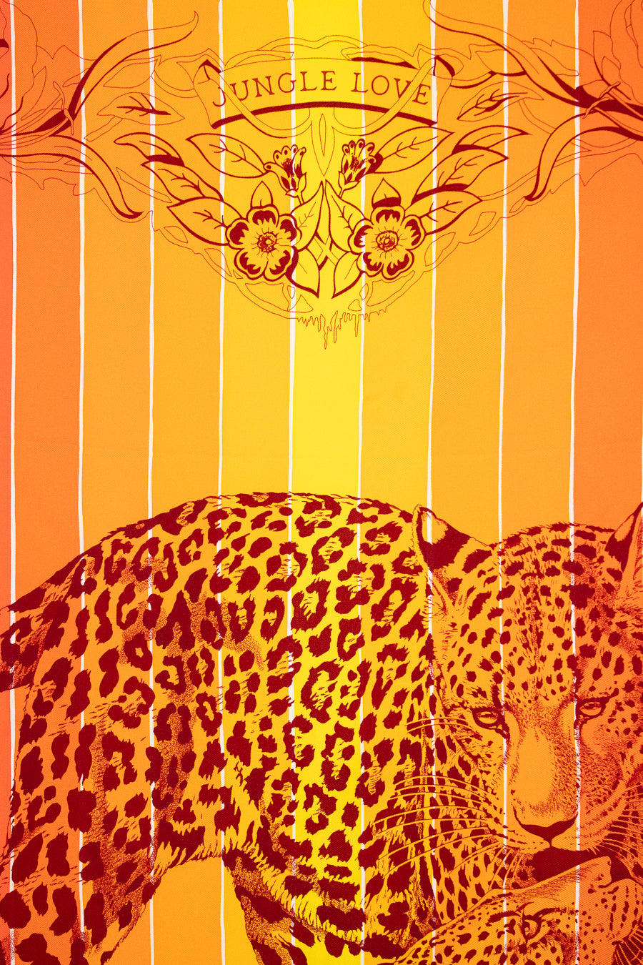 Leopard design with 'Jungle Love' text on an orange and yellow striped background