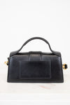 Black handbag with gold accents on a white background