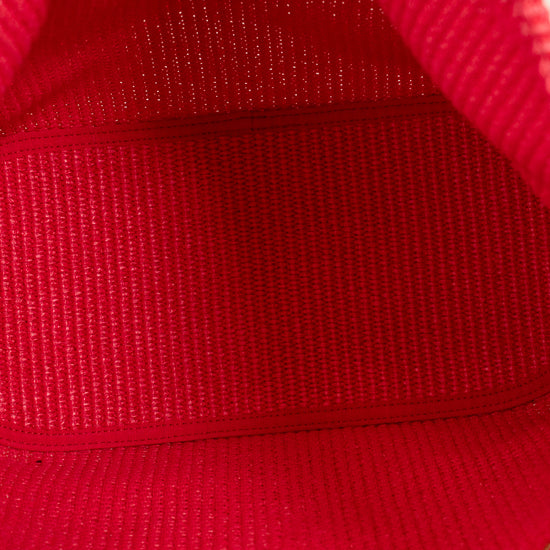 Close-up of a red fabric texture with gold lettering.