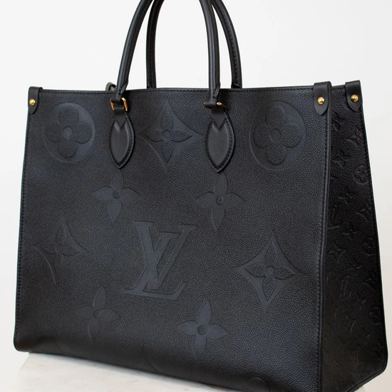 Black embossed handbag on a white background