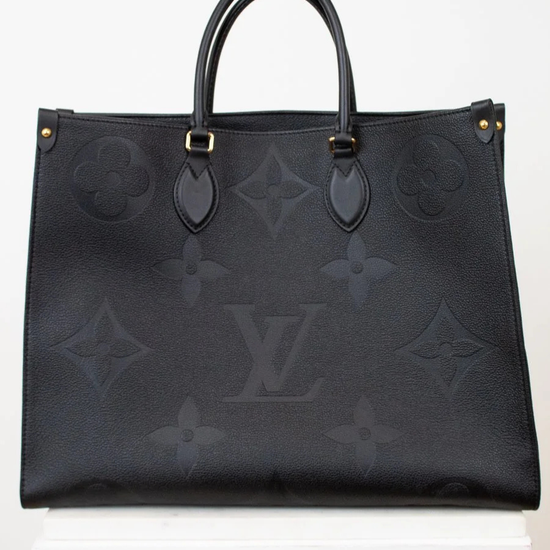 Black handbag with brand logo on a white background