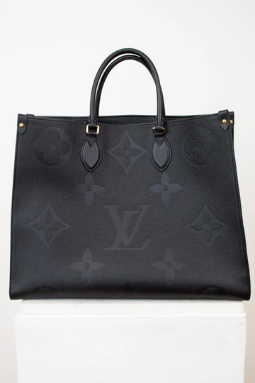 Black handbag with brand logo on a white background