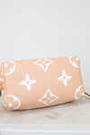 Base of Louis Vuitton bag with logo pattern on a light background