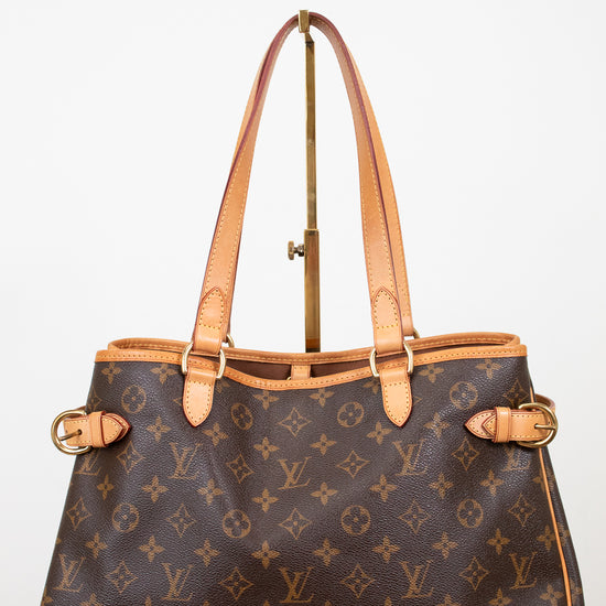 Designer handbag with monogram pattern on a white background