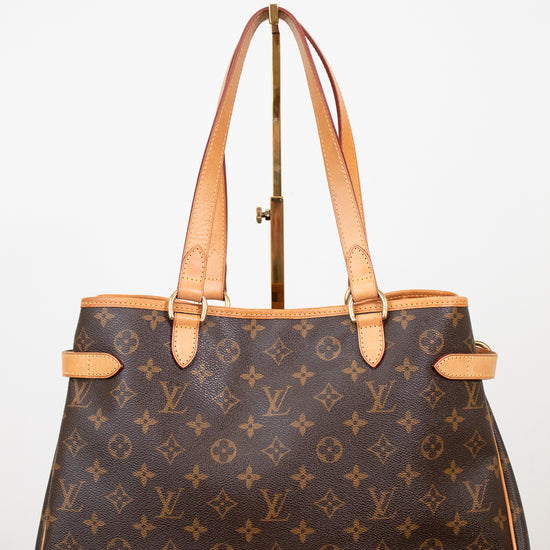 Designer handbag with monogram pattern on a white background