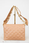 Beige handbag with gold chain strap on a white background
