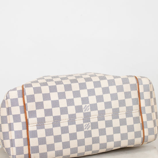 Checkered handbag with visible brand logo on a light background