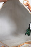 Close-up of a metallic surface with a decorative element.