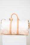 Designer handbag with a gradient design on a white background