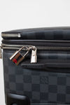 Black checkered suitcase with a silver lock on a white background