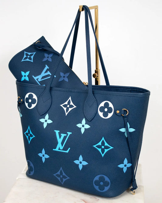 Blue handbag with brand logo on a white background