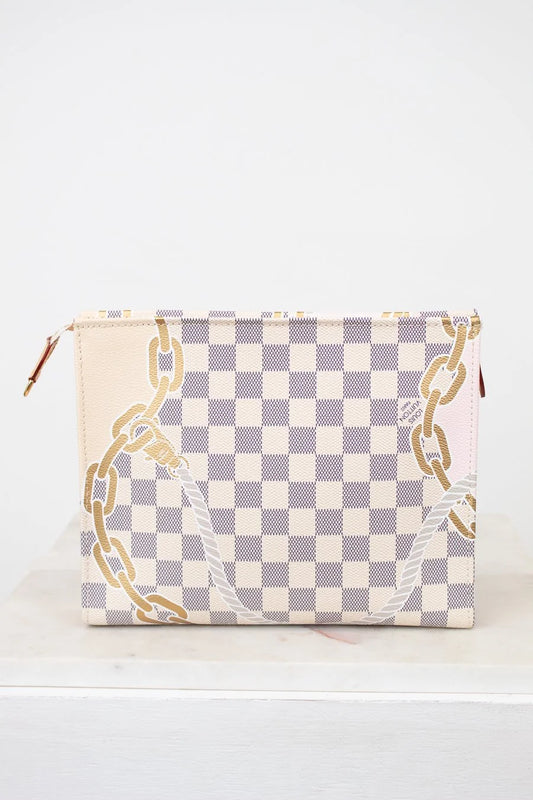Checkered pouch with gold chain design on a white background