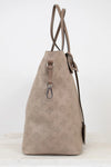 Beige handbag with monogram pattern on a white background