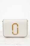 White handbag with gold clasp on a white background