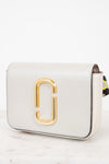 White handbag with gold logo on a white background