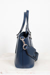 Navy blue handbag with a strap on a white background