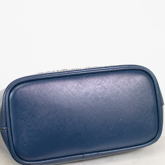 Blue base of handbag on a white marble surface