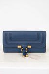 Blue wallet with gold accents on a white background