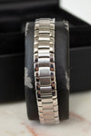 Silver bracelet on a black cushion with a blurred background