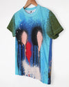 T-shirt with artistic design of two faces kissing on a hanger against a white background